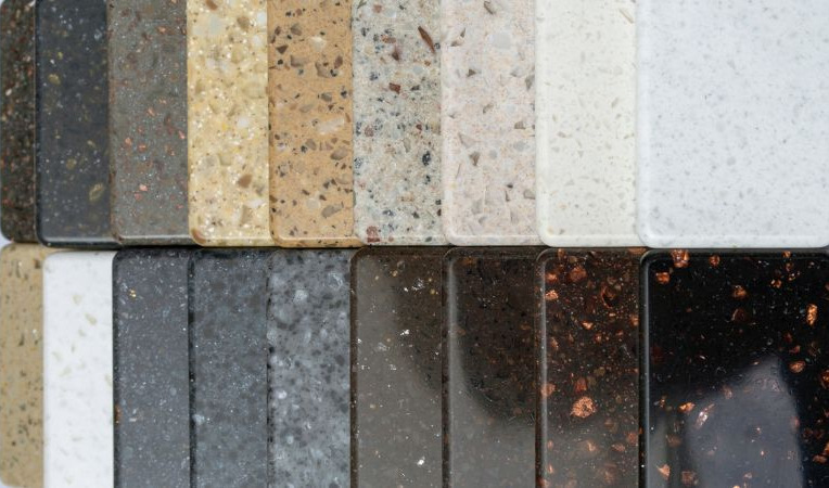 Two rows of brown and grey granite in various tones are laid out neatly